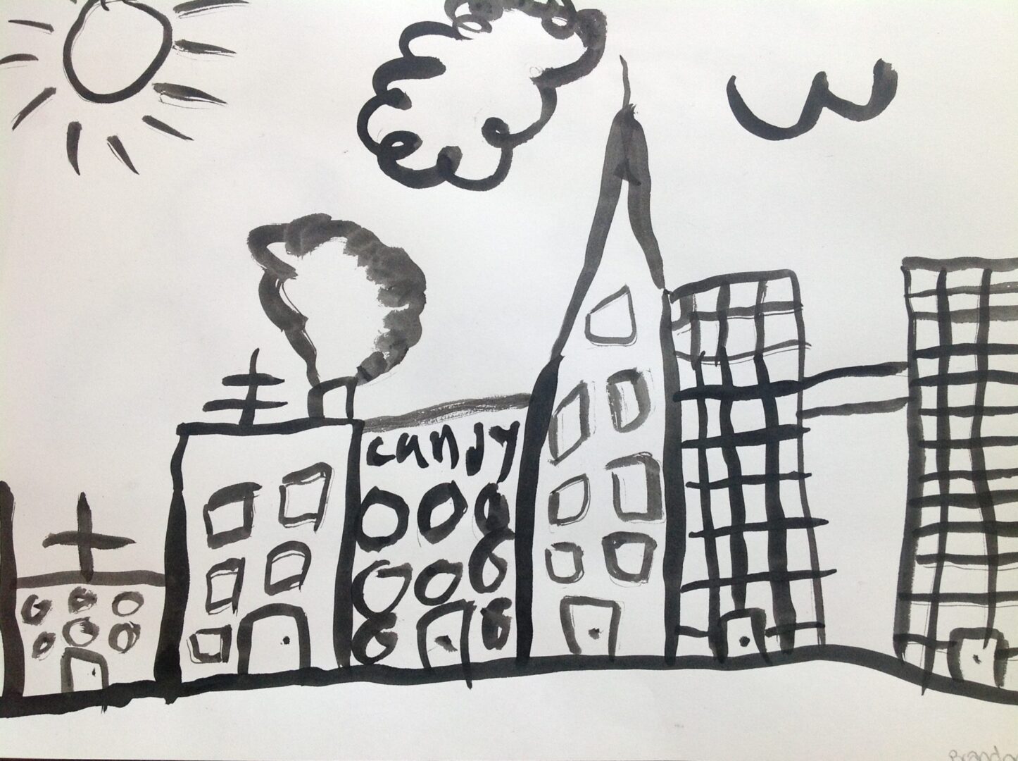 A drawing of a city with buildings and a sun.