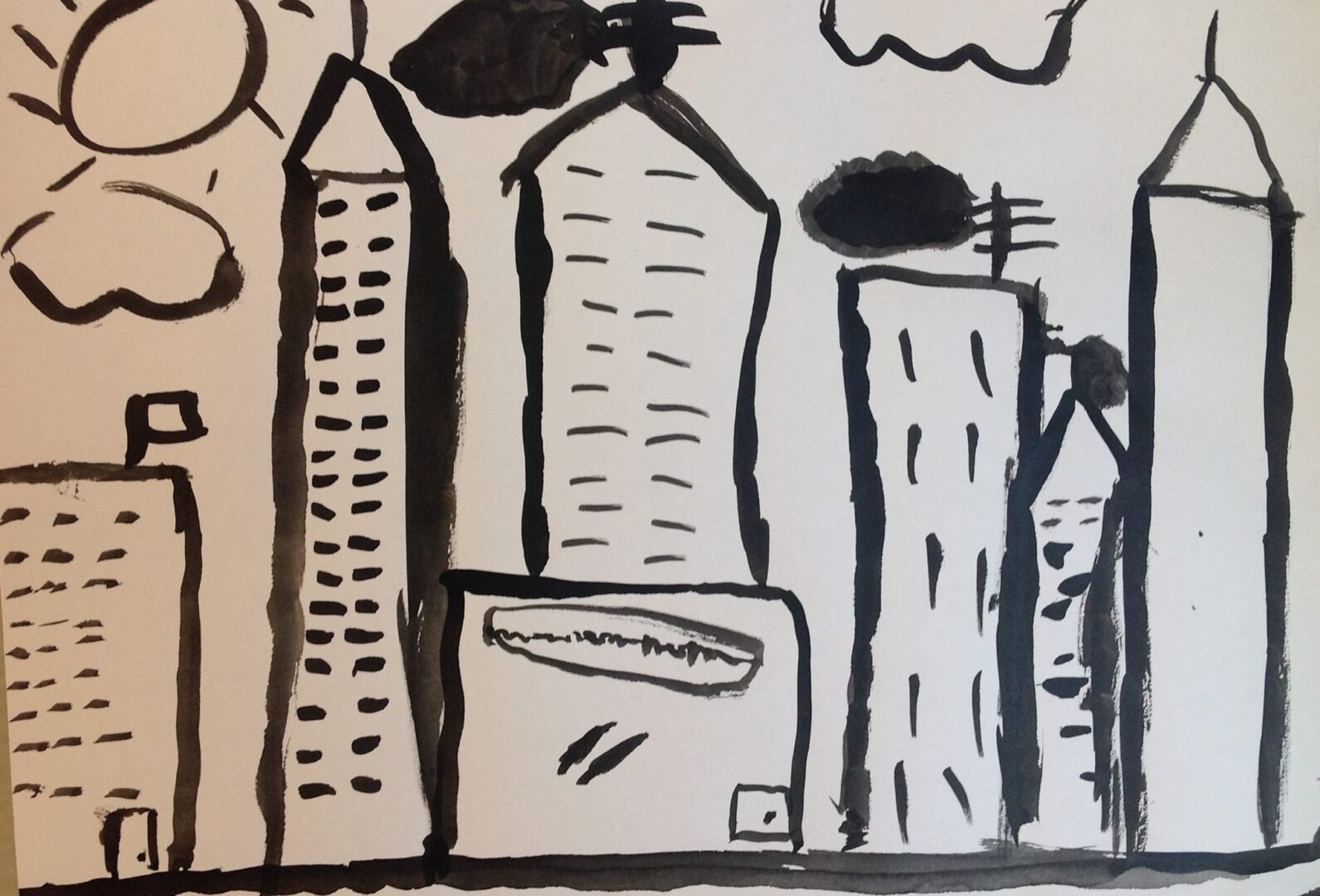 A black and white drawing of a city skyline.