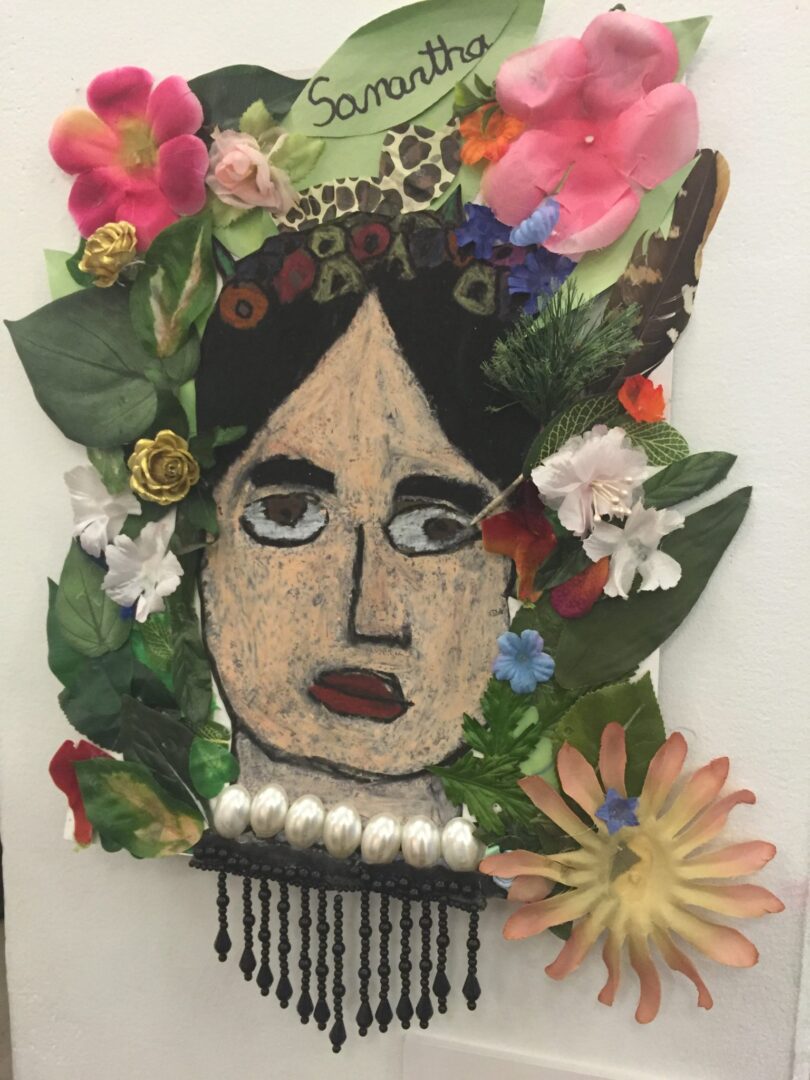 A collage of flowers and leaves with a woman's face.