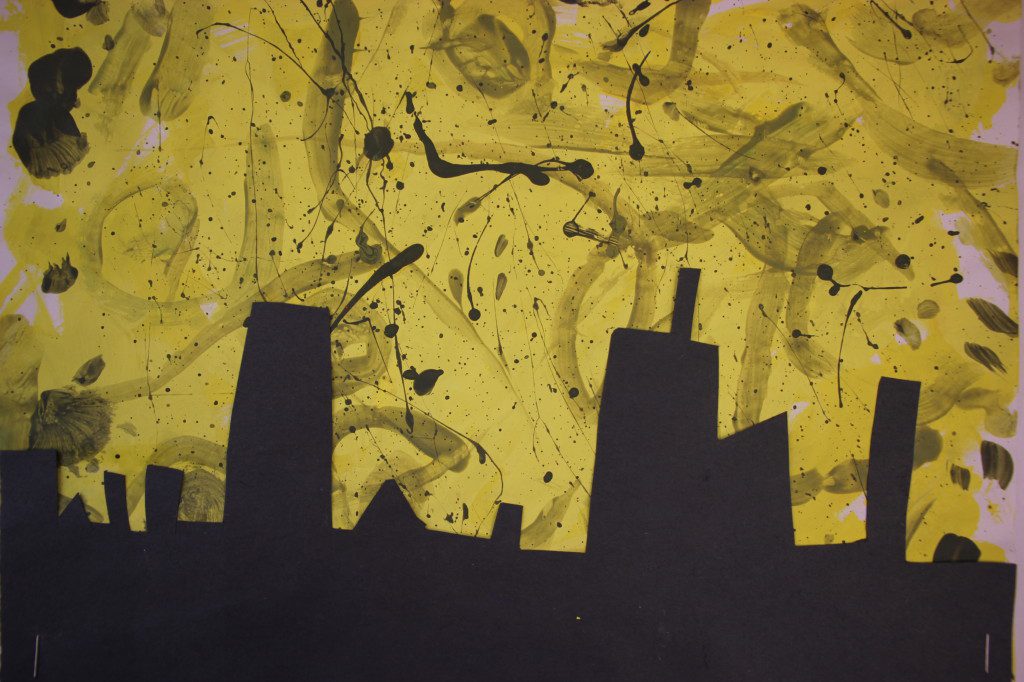 A black and yellow painting of a city with splatters.