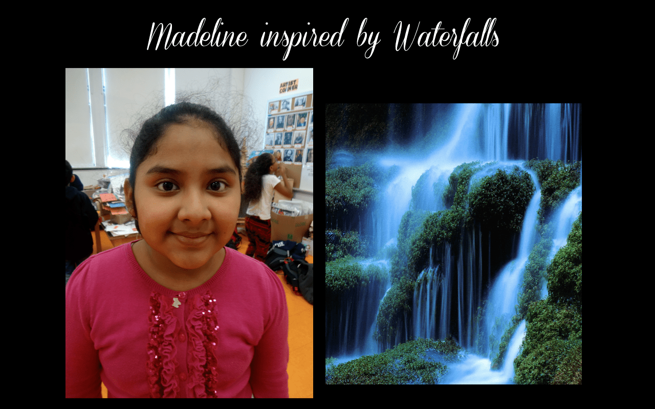 A girl is standing in front of a waterfall.