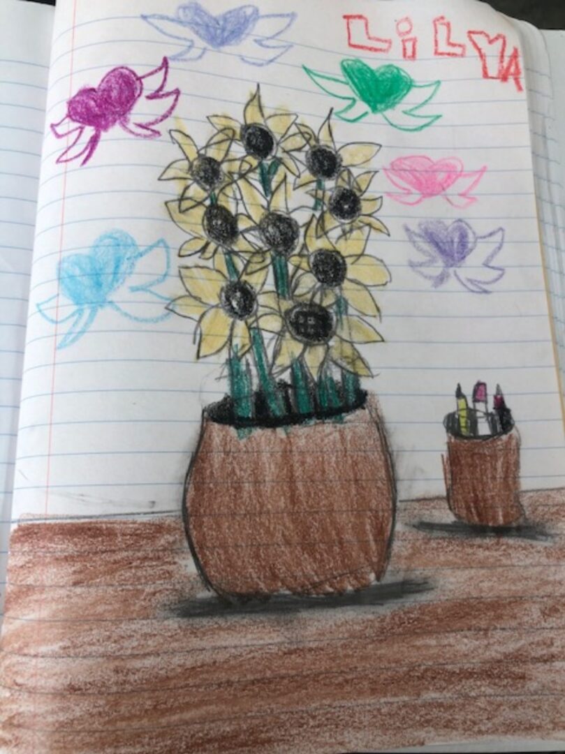 A child's drawing of sunflowers in a pot.