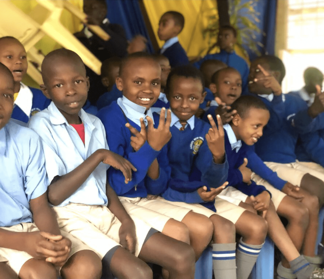 Group of boys in school uniform smiling