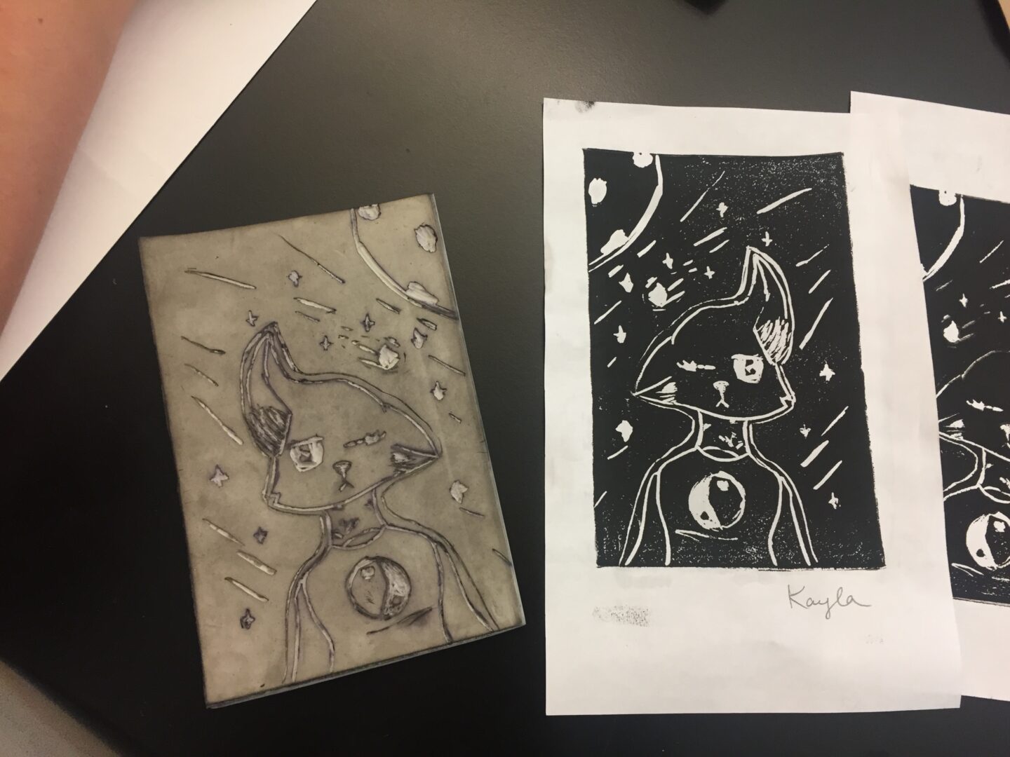 Two pieces of paper with a drawing on them.